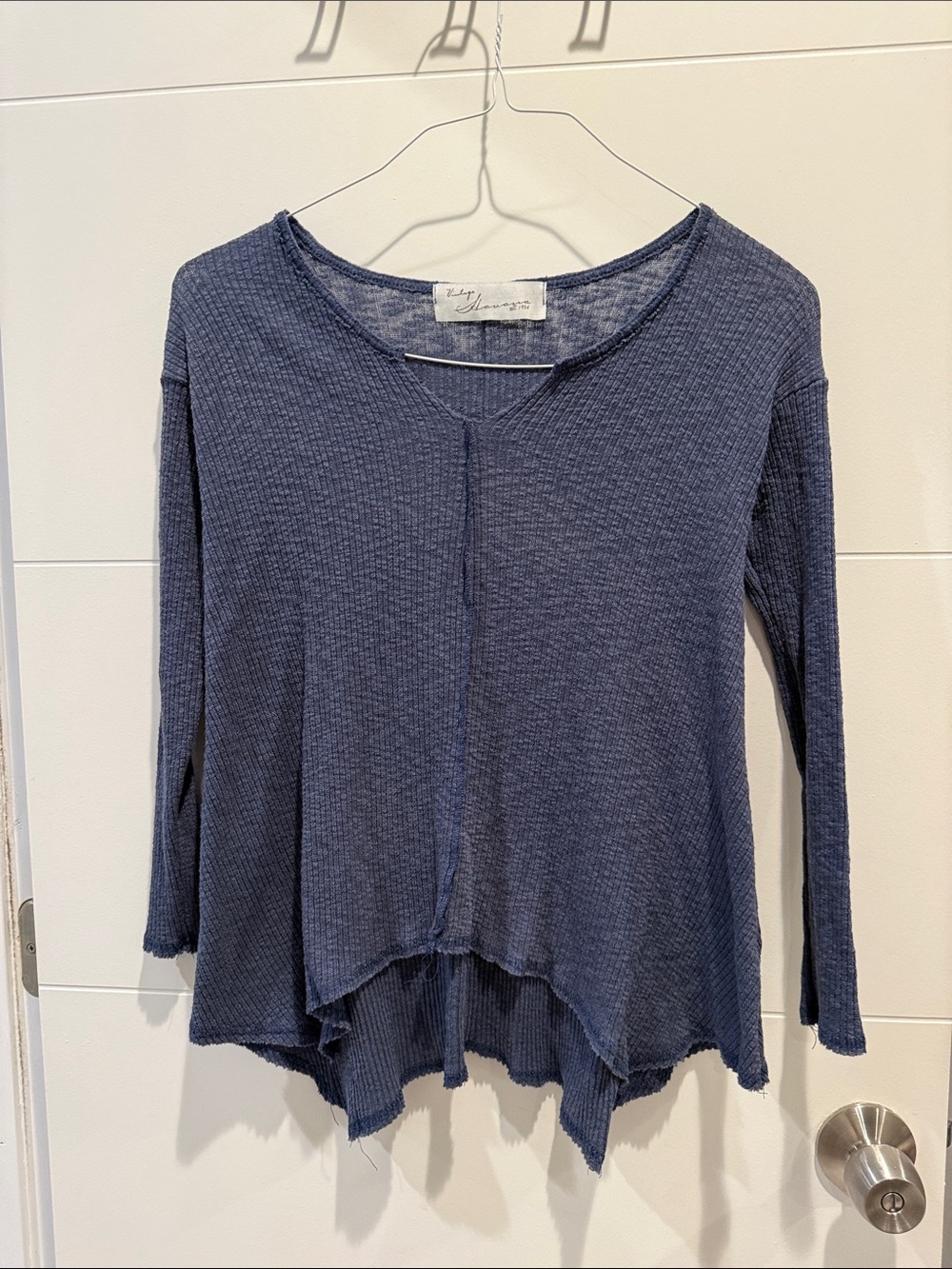 Distressed style long sleeve top